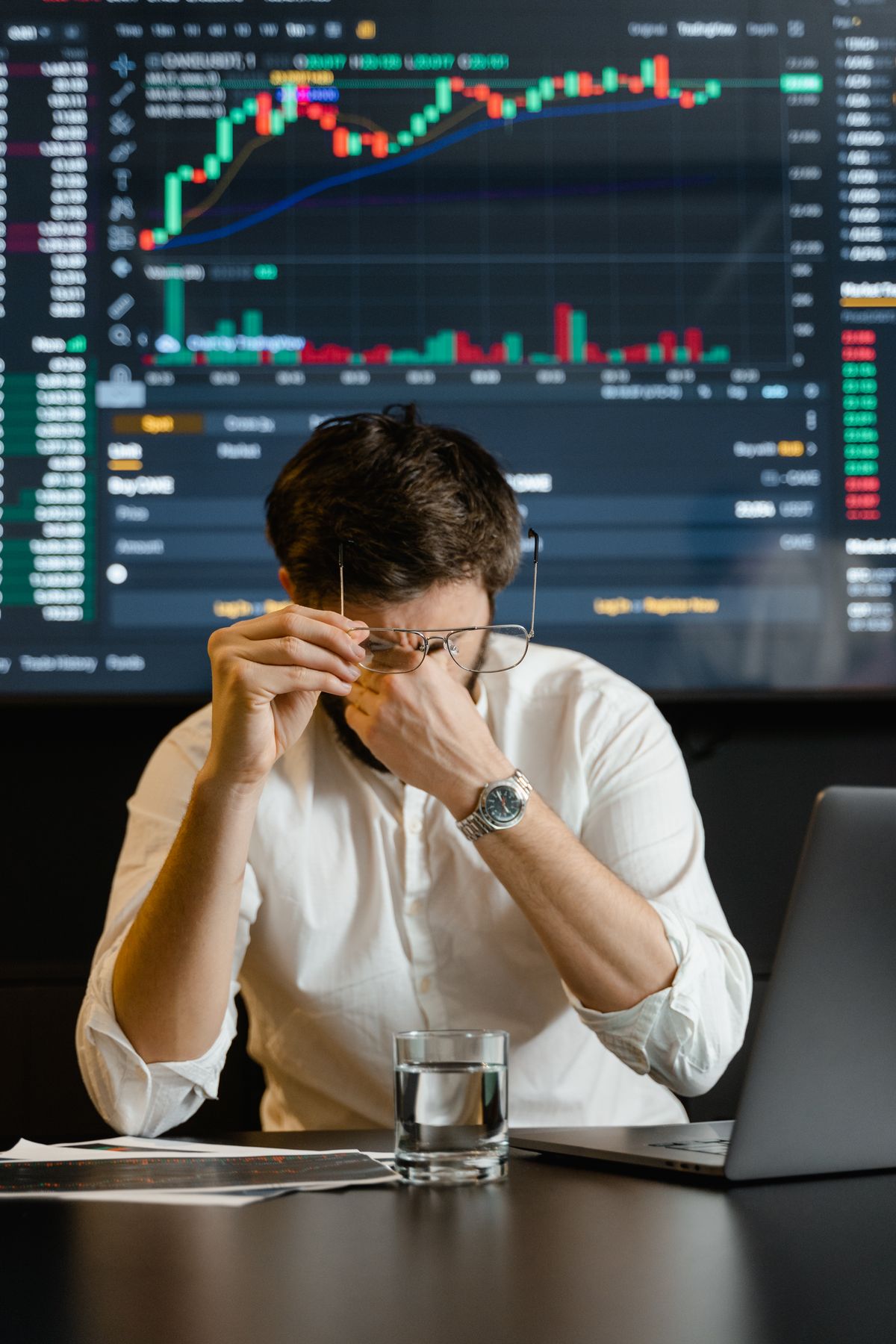 Multi-monitor workstation showing API usage dashboard and code editor — 2026 AI API pricing comparison