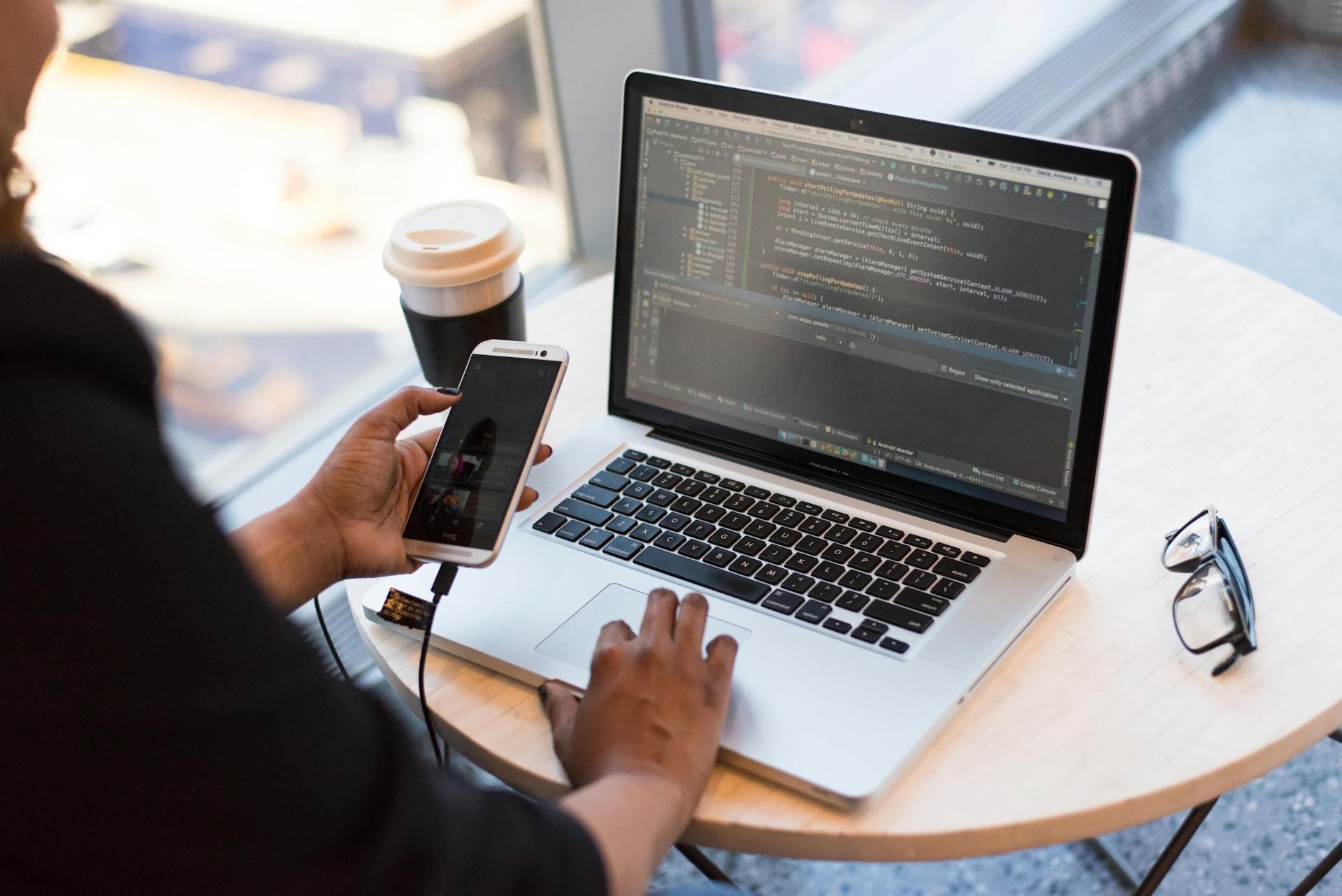 Laptop and phone representing Expo EAS iOS builds and cloud Mac CI